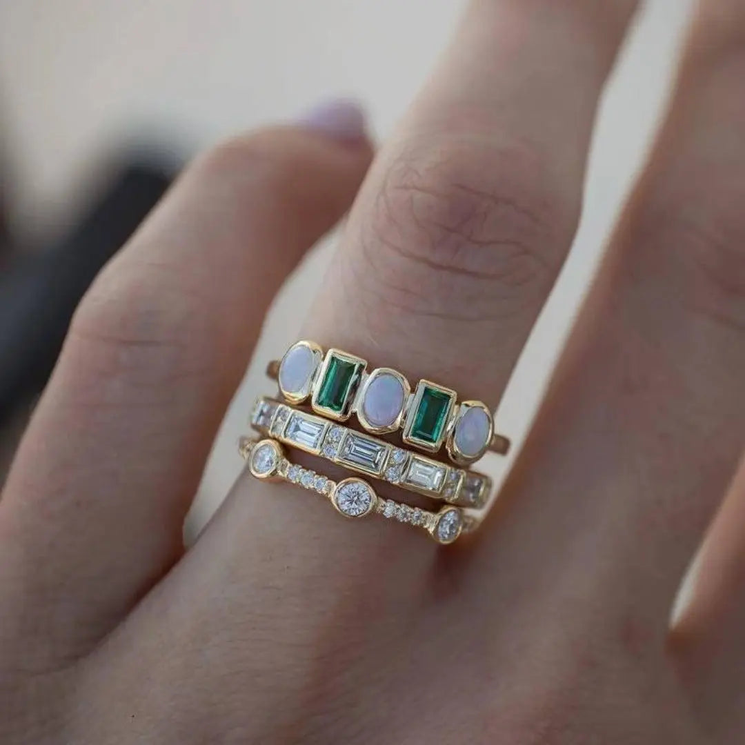 Vintage rings with white and green opal-style