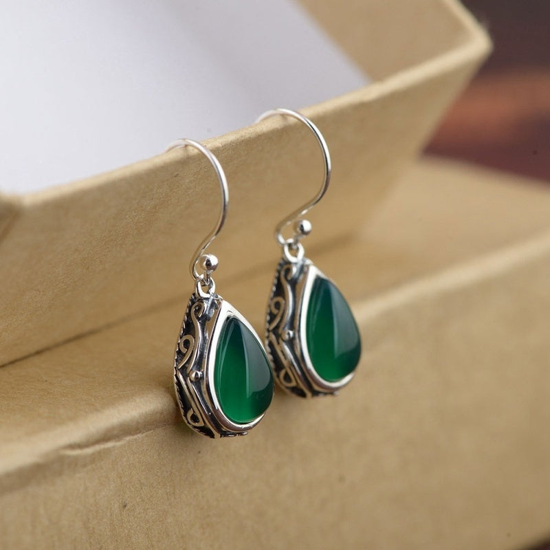 Silver-Tone earrings with green stone-style stone