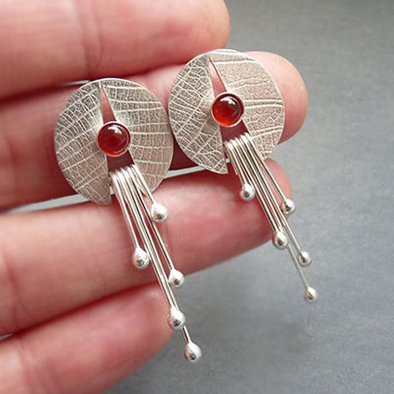 Silver-Tone earrings with red stone-style accents